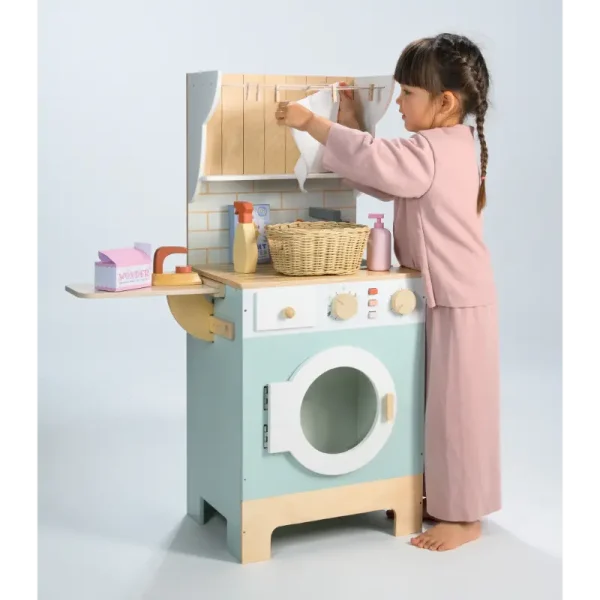 Little girl hanging pretend washing